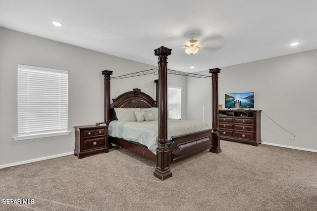 bedroom featuring light colored carpet and ceiling fan