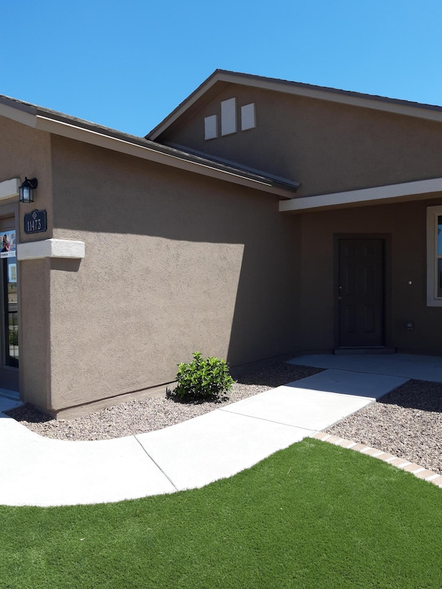 view of home's exterior featuring a yard