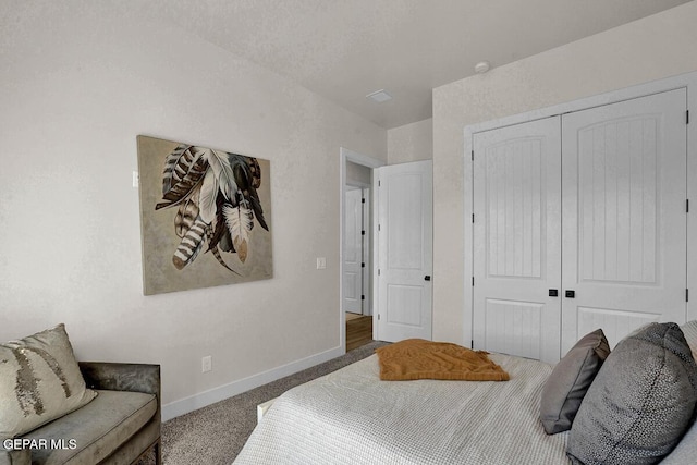 bedroom featuring a closet and carpet floors