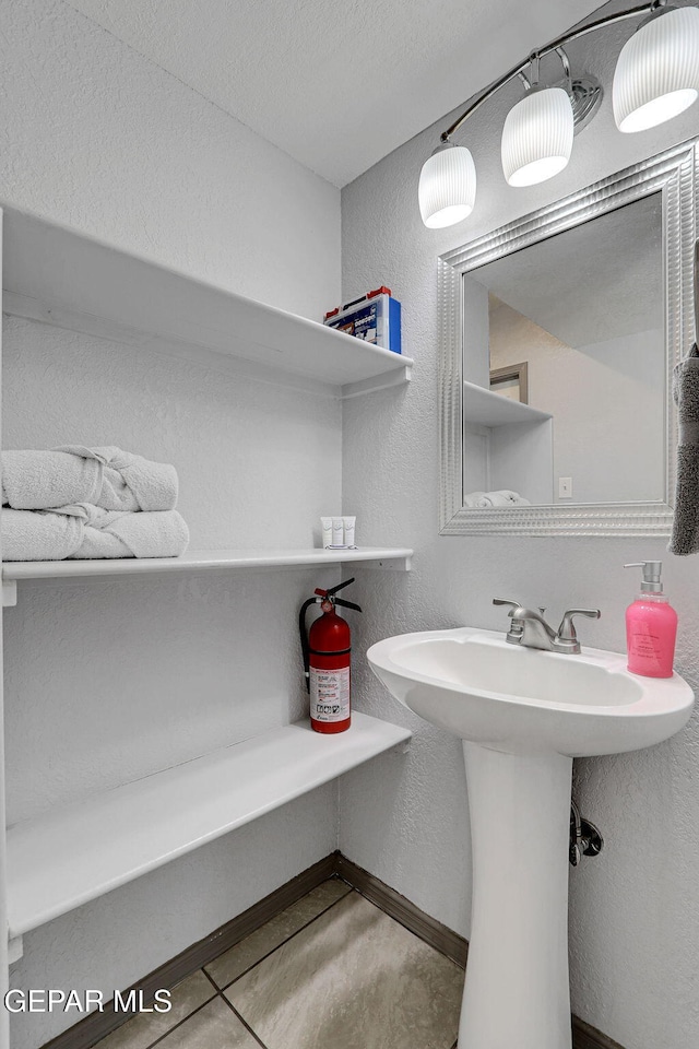 bathroom featuring sink and tile patterned flooring