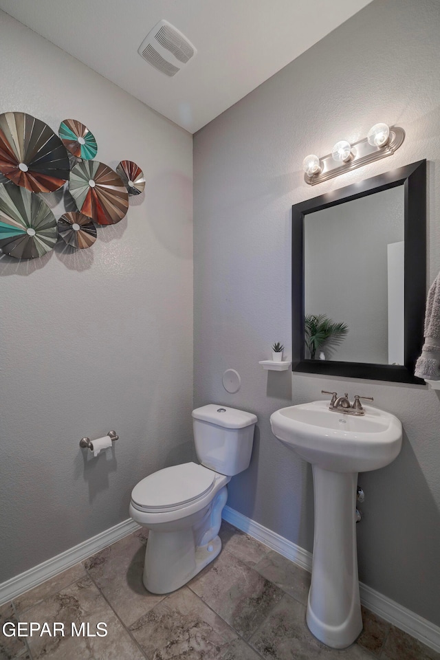 bathroom featuring sink and toilet