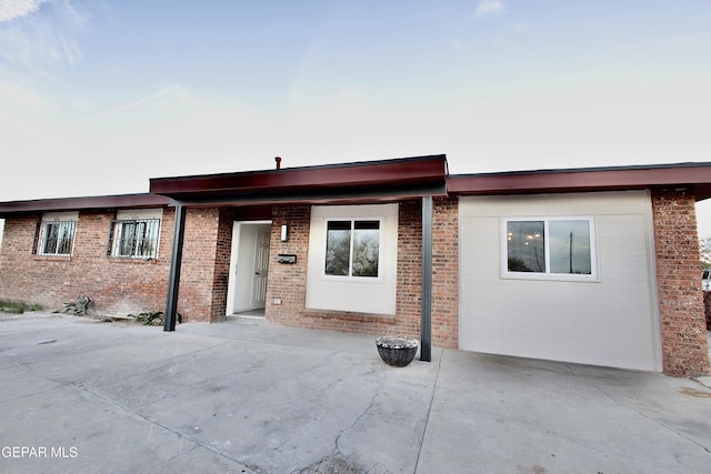 view of front of home with a patio