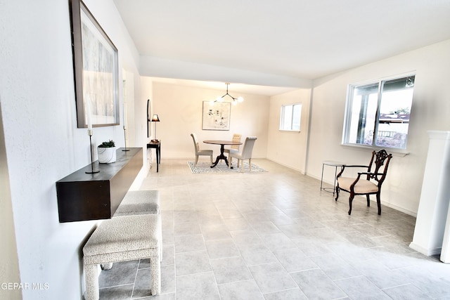 interior space featuring light tile patterned floors and an inviting chandelier