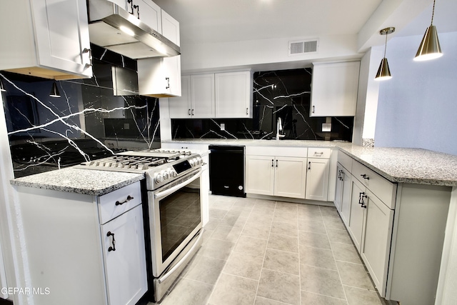 kitchen featuring gas stove, backsplash, and white cabinets