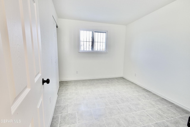 empty room with light tile patterned flooring