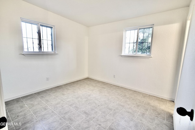 spare room with plenty of natural light