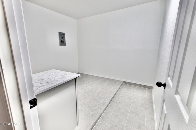 clothes washing area featuring light tile patterned floors and hookup for a washing machine