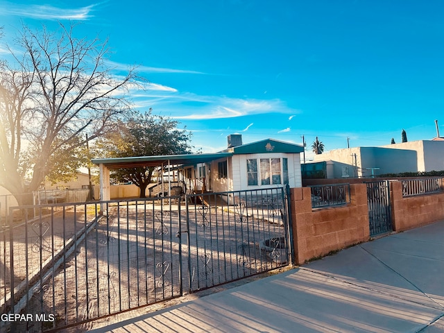 view of front of home with a carport