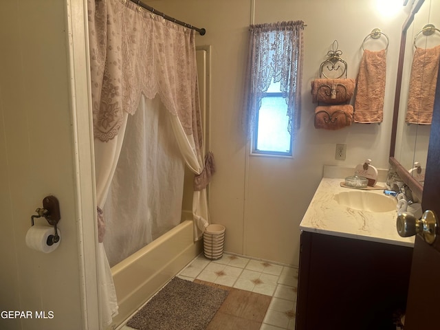 bathroom featuring vanity and shower / bathtub combination with curtain