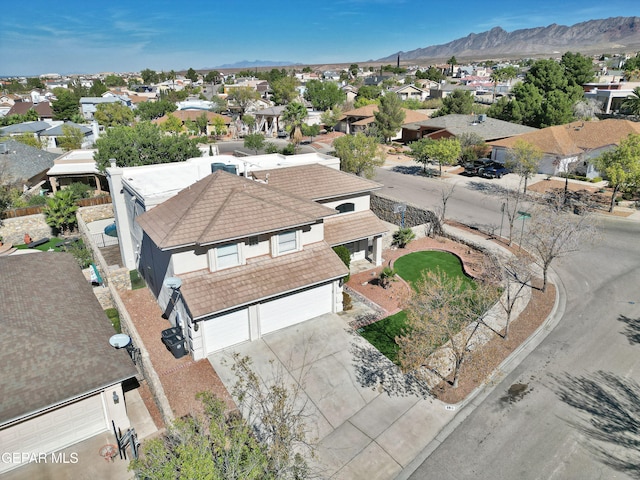 birds eye view of property featuring a mountain view