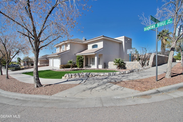 view of front of house featuring a front yard and a garage