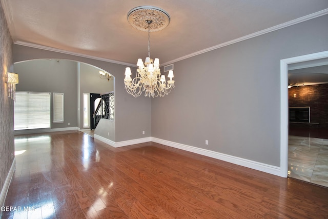 unfurnished room with crown molding and hardwood / wood-style floors