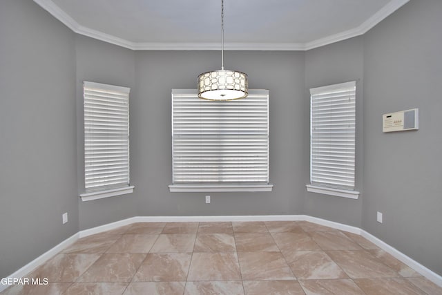 empty room featuring crown molding