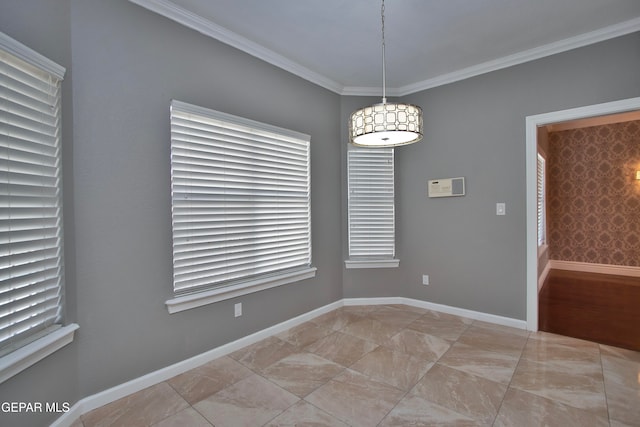 empty room featuring crown molding