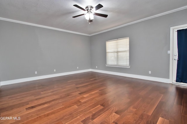 spare room with dark wood-type flooring, crown molding, a textured ceiling, and ceiling fan