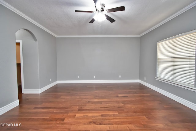 spare room featuring a textured ceiling, crown molding, dark hardwood / wood-style floors, and ceiling fan