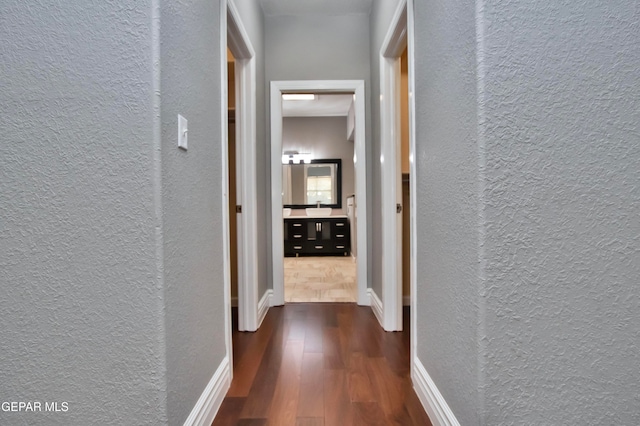 hall with dark hardwood / wood-style flooring