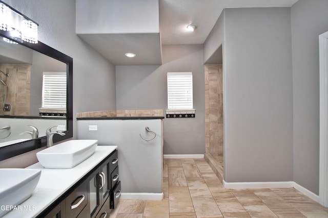 bathroom featuring vanity and a shower