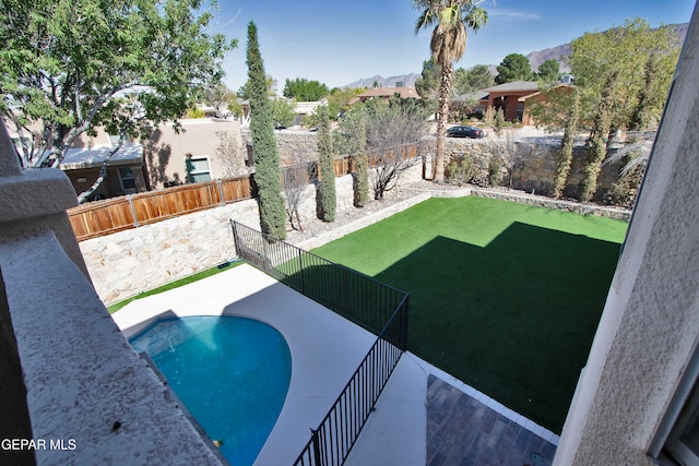 view of pool featuring a mountain view and a patio area