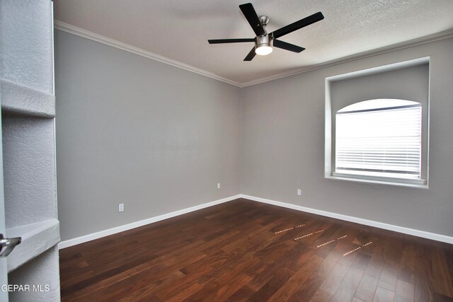 empty room with ornamental molding, a textured ceiling, dark wood-type flooring, and ceiling fan