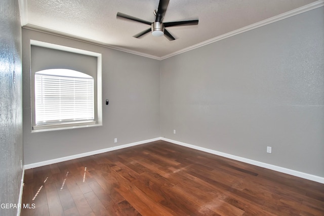 empty room with dark wood-type flooring, ceiling fan, ornamental molding, and a textured ceiling