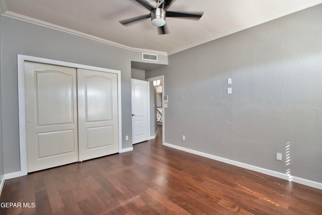 unfurnished bedroom featuring ceiling fan, crown molding, and dark hardwood / wood-style floors