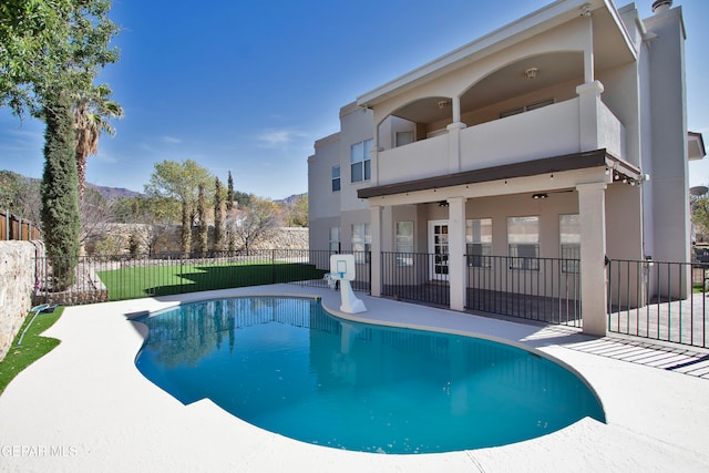 view of pool featuring a patio area and a mountain view