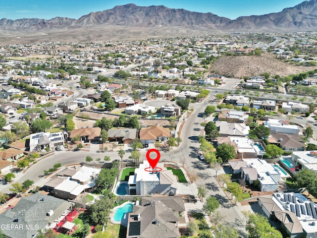 birds eye view of property with a mountain view