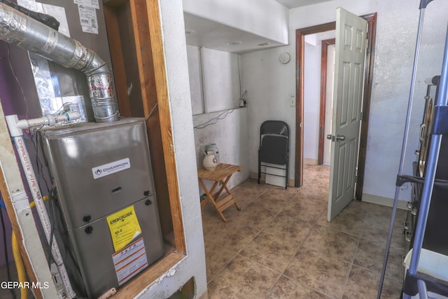 utility room with heating unit