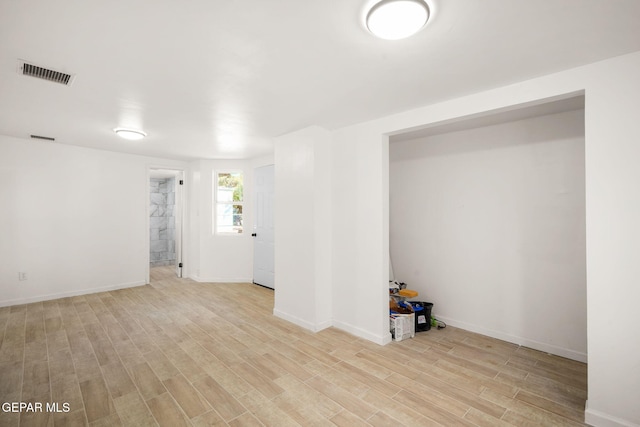 basement featuring light wood-type flooring