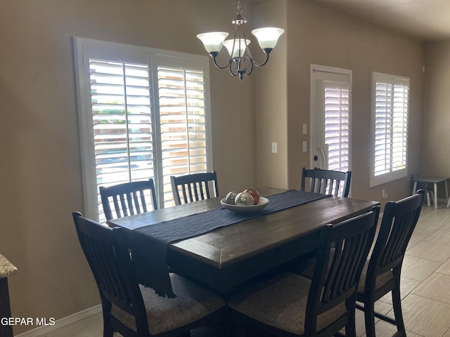 dining area featuring a notable chandelier