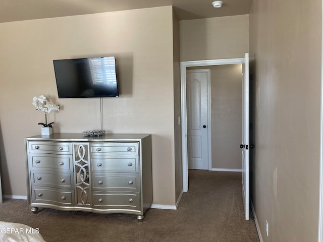 unfurnished bedroom featuring dark colored carpet