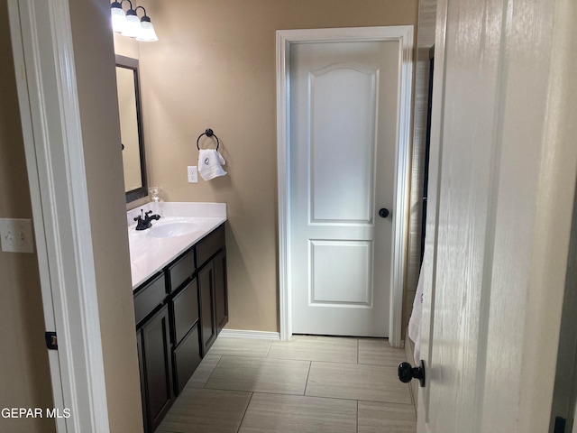 bathroom featuring vanity and tile patterned flooring