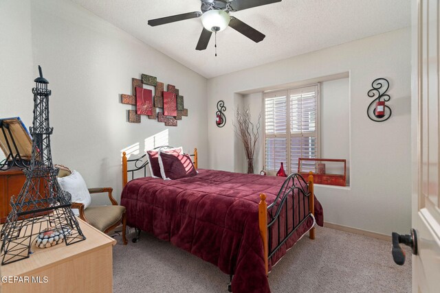 carpeted bedroom featuring ceiling fan, a textured ceiling, and lofted ceiling