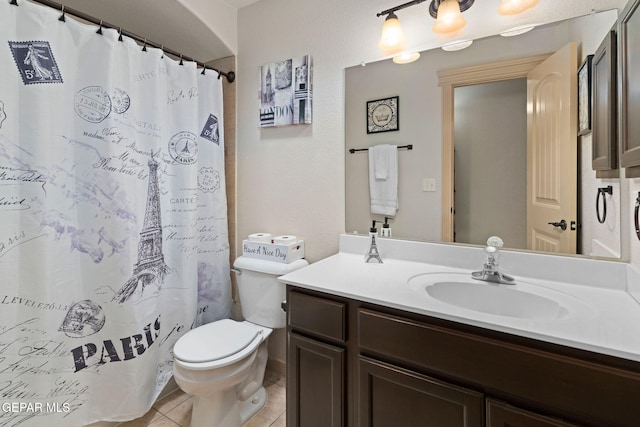 bathroom featuring vanity, toilet, tile patterned floors, and a shower with shower curtain