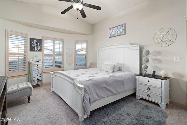 bedroom with ceiling fan, carpet, and lofted ceiling