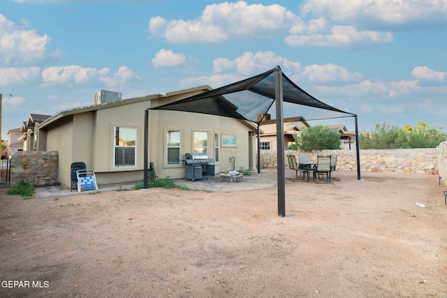 back of property with a patio area