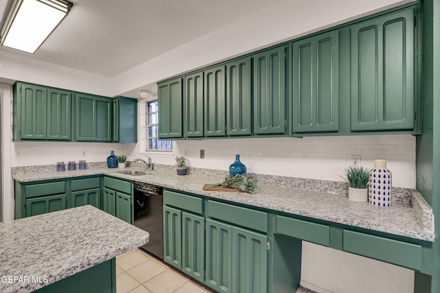 kitchen with black dishwasher, light tile patterned floors, a textured ceiling, sink, and green cabinetry