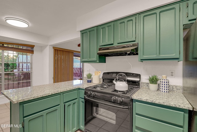 kitchen featuring gas stove, kitchen peninsula, green cabinetry, and plenty of natural light