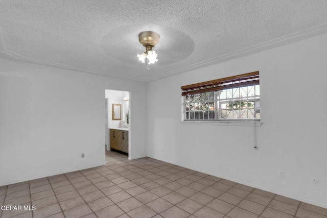 unfurnished room featuring ceiling fan, a textured ceiling, and light tile patterned floors