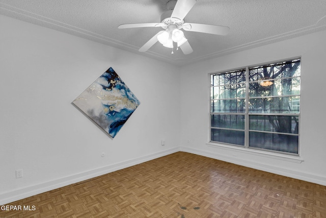 unfurnished room featuring parquet floors, a textured ceiling, and ceiling fan