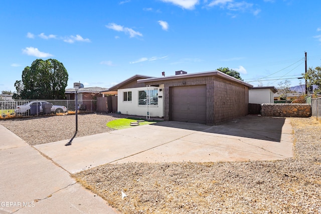 ranch-style house featuring a garage