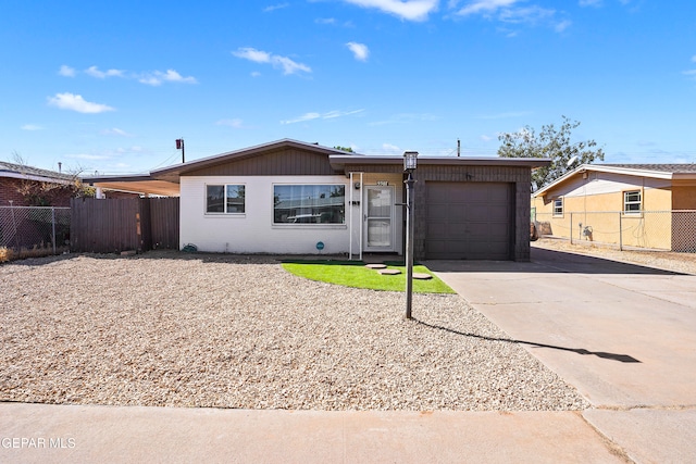 ranch-style house featuring a garage