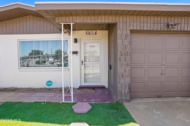 view of exterior entry featuring a garage