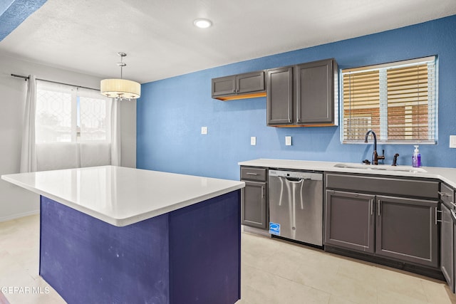 kitchen with stainless steel dishwasher, sink, hanging light fixtures, and a kitchen island