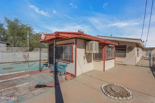 back of property with a patio