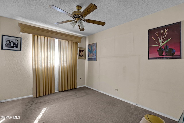 unfurnished room with ceiling fan, carpet, and a textured ceiling