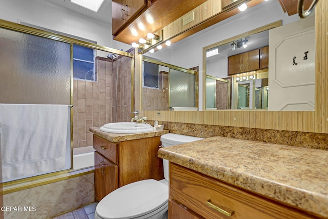 full bathroom with vanity, enclosed tub / shower combo, toilet, and tile patterned flooring