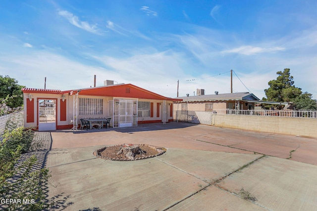 rear view of house with a patio area