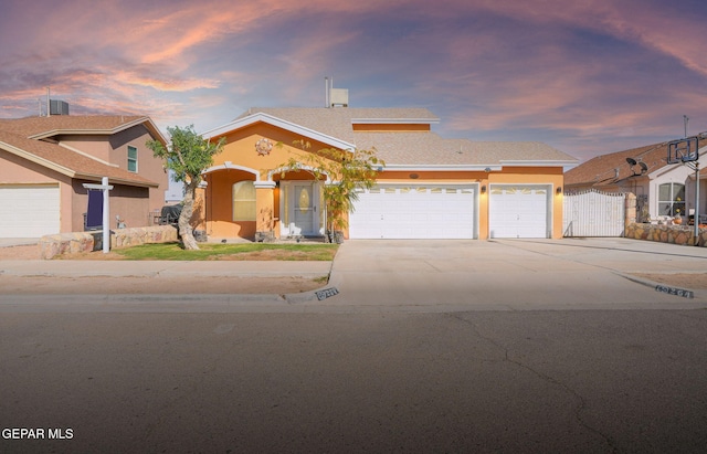 view of front of property with a garage